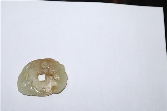 A Chinese pale celadon jade bat bi disc and two cherry amber elephants